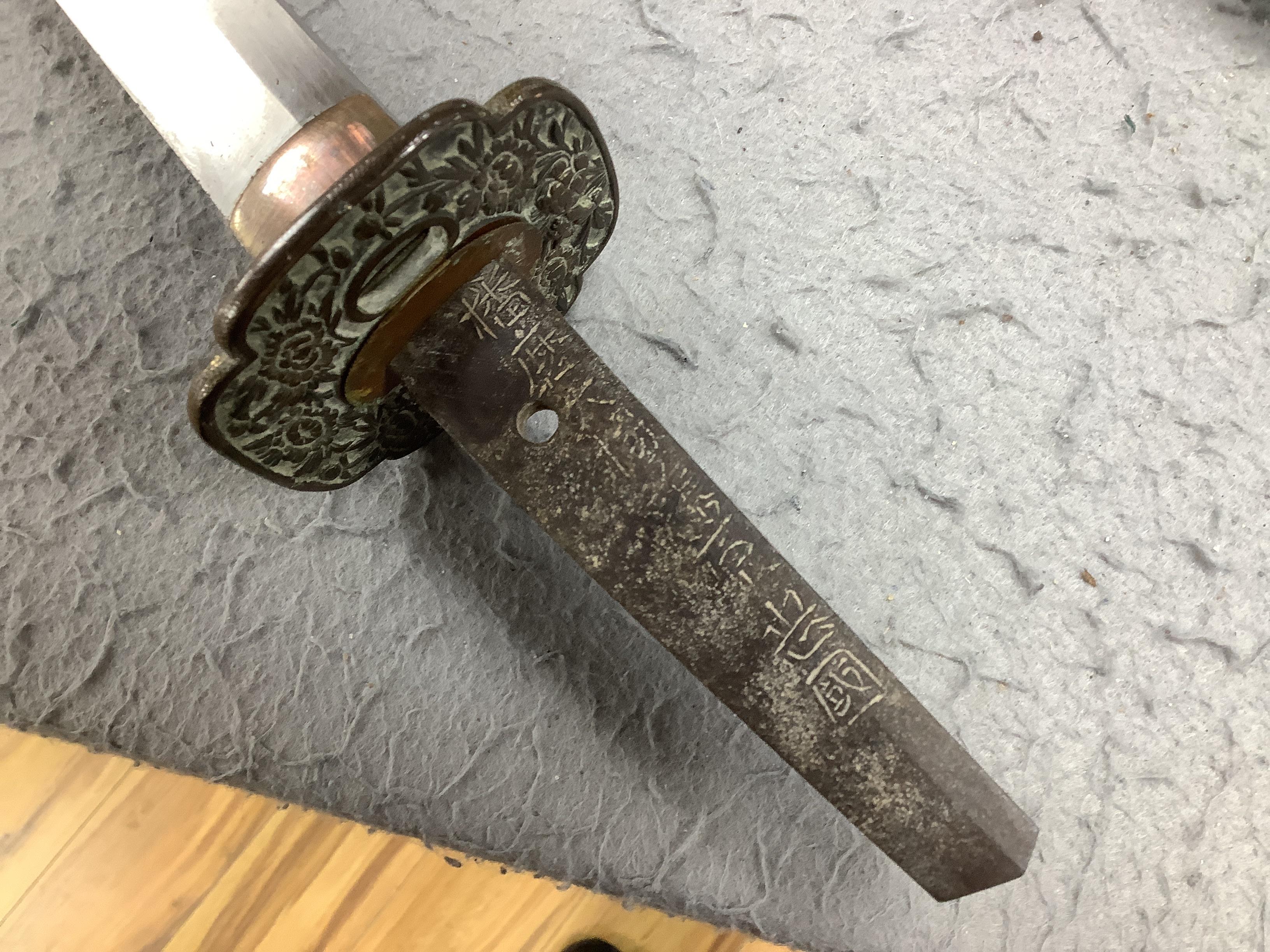 A 19th century Japanese katana with signature to the tang, with chiselled bronze tsuba and gilt metal menuki, and six various knives, blade 57cm